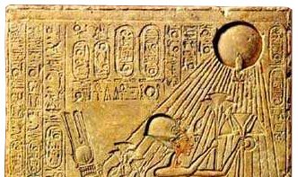 Stela from El-Amarna, Egyptian King Akhenaten is seen with his wife Nefertiti and their daughters bearing offerings to the sun-disk Aten.