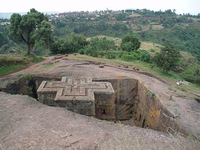 Priest in Bet Danaghel Church holding the Cross of King Lalibela. The  rock-hewn churches of Lalibela make it one of the greatest  Religio-Historical sites not only in Africa but in the Christian