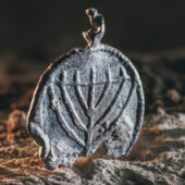 The rare menorah pendant discovered near the Temple Mount. Courtesy Eliyahu Yanai, City of David