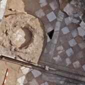 Side by side of archaeological remains of baptismal font with modern illustration. floor is checkered with red and white tiles. Courtesy Michael Eisenberg