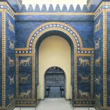 arched entry with blue glazed walls around with creatures like lions depicted upon the walls. Credit: via Wikimedia Commons, CC BY-SA 4.0.