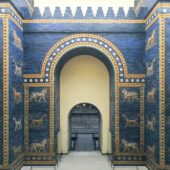 arched entry with blue glazed walls around with creatures like lions depicted upon the walls. Credit: via Wikimedia Commons, CC BY-SA 4.0.